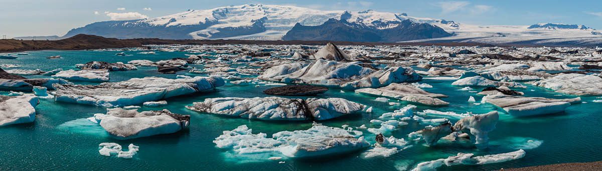 Panorama of The Iceberg Lagoon, Jokulsarlon, Iceland filled with glacial Icebergs with the Vatnajokull Glacier in the background, Europe's biggest glacier  Shot in summer 2009 when the lagoon had the greatest number of icebergs for decades  Panoramic header web banner 