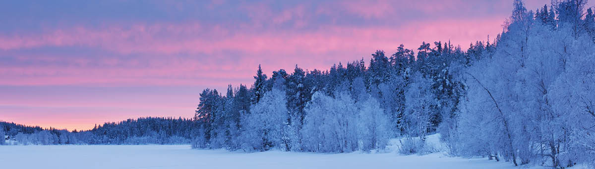 Sunset over a frozen lake  A seamlessly stitched panoramic image 
