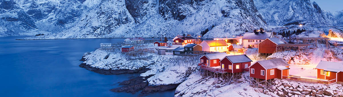 Traditional Norwegian fisherman's cabins, rorbuer, on the island of Hamnøy, Reine on the Lofoten in northern Norway  Photographed at dawn in winter 