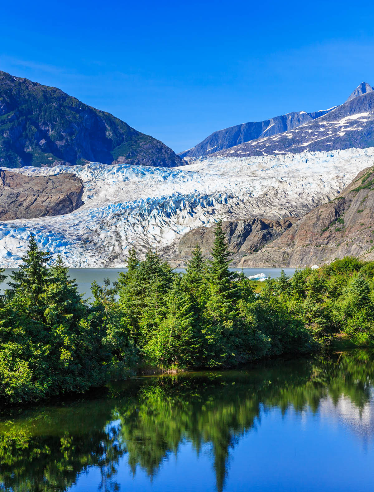 Juneau, Alaska. Mendenhall Glacier Viewpoint with reflection in the lake.