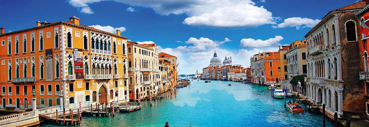 Ancient buildings and gondola along Canal Grande in Venice Italy
