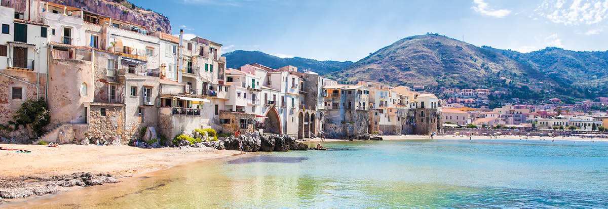 Beautiful old harbor with wooden fishing boat in Cefalu, Sicily, Italy 