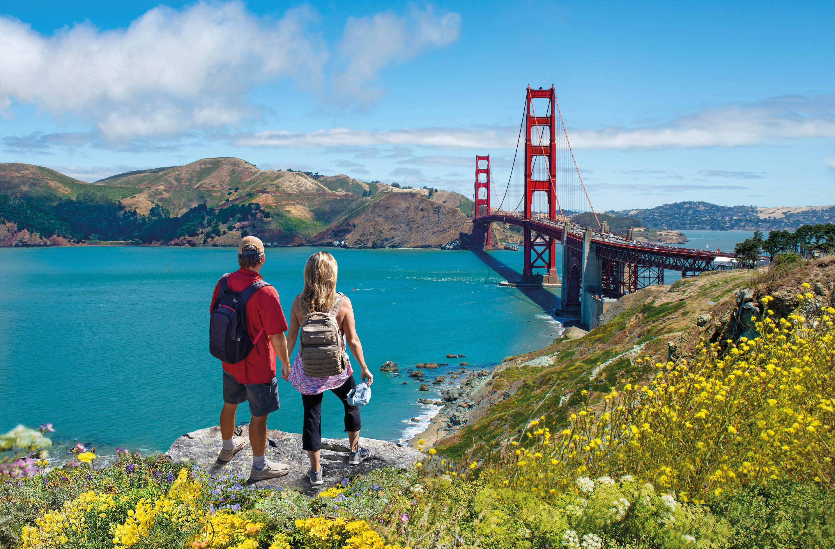 Couple enjoying beautiful coastal scenery on summer vacation. People on vacation  in San Francisco. Golden Gate Bridge, San Francisco Bay, San Francisco, California, USA.