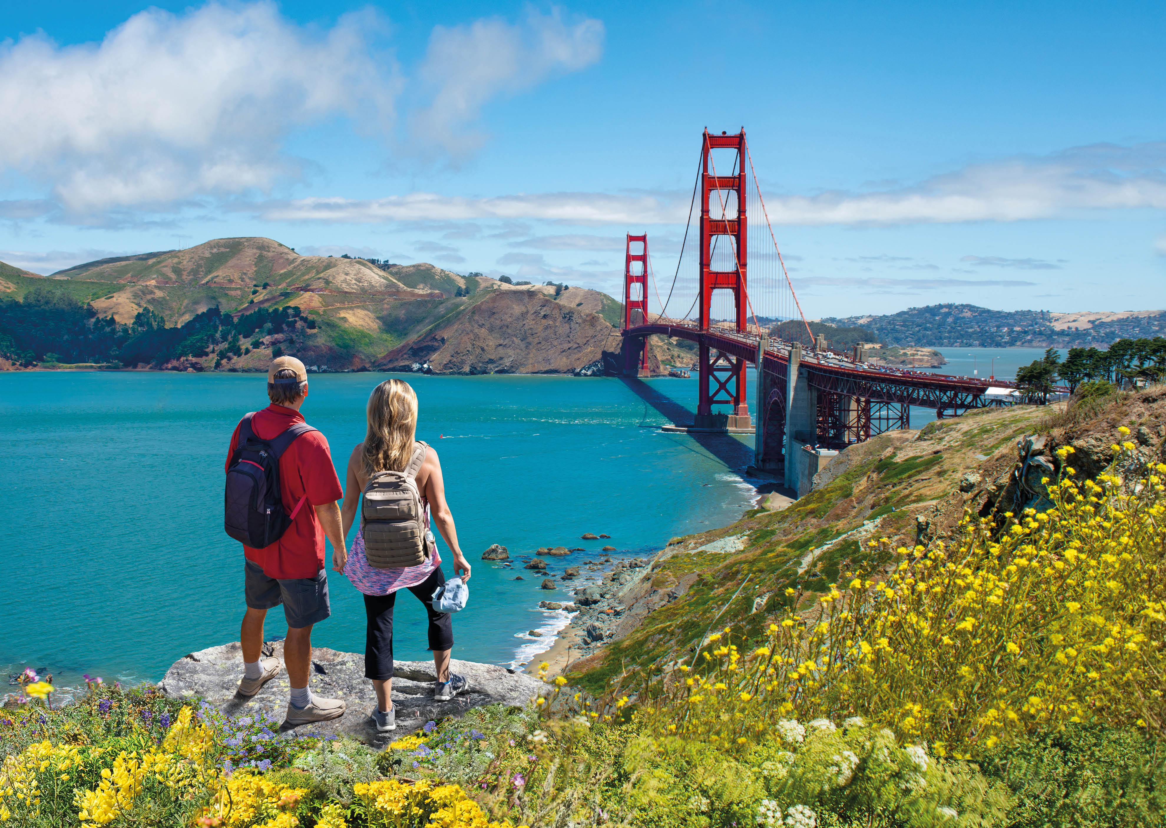Couple enjoying beautiful coastal scenery on summer vacation. People on vacation  in San Francisco. Golden Gate Bridge, San Francisco Bay, San Francisco, California, USA.