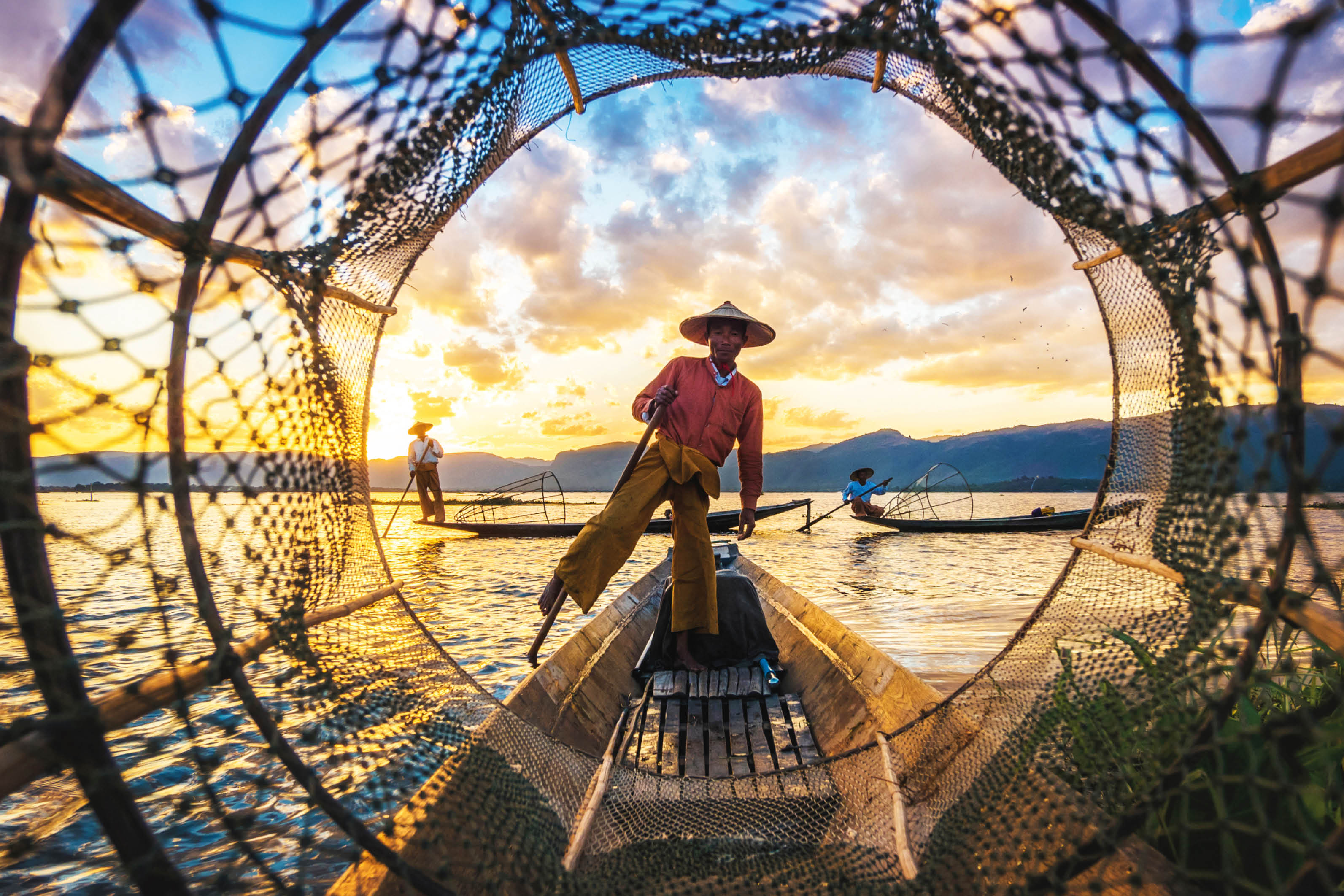 Inle Lake Intha fishermen at sunset in Myanmar (Burma).