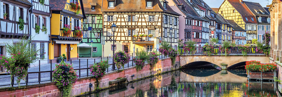 Colorful traditional french houses on the side of river Lauch in Petite Venise, Colmar, France