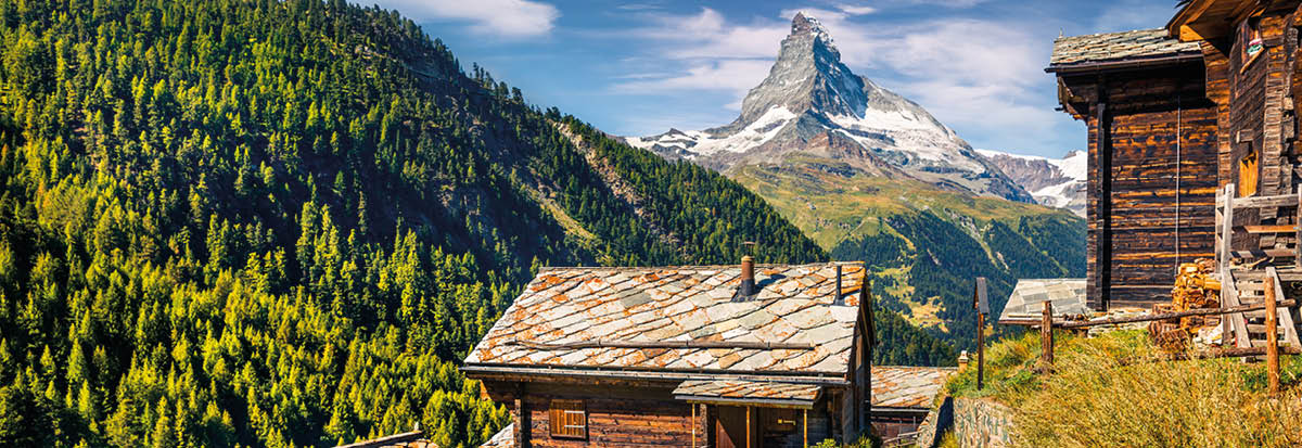Sunny summer morning in Zermatt village with Matterhorn (Monte Cervino, Mont Cervin) peak on backgroud  Beautiful outdoor scene in  Swiss Alps, Valais canton, Switzerland, Europe 