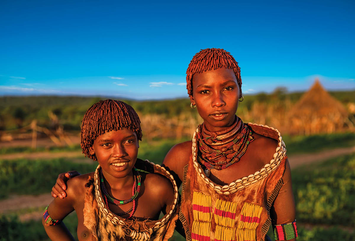 Young women from Hamer posing in a village, Omo Valley, Southern Ethiopia  The Hamer tribe is an indigenous group of people in Africa, and this tribe lives in the southwestern region of the Omo Valley near Kenya, Africa  They are largely pastoralists 