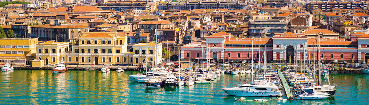 Beautiful view of Catania cruise port with smoking volcano Etna in the background 