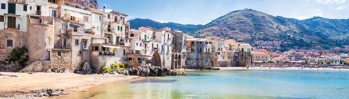 Beautiful old harbor with wooden fishing boat in Cefalu, Sicily, Italy 