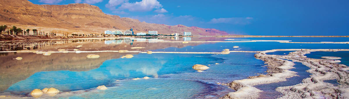 Hot summer day on the Dead Sea  The evaporated salt has developed into fantastic patterns  The concept of medical and ecological tourism