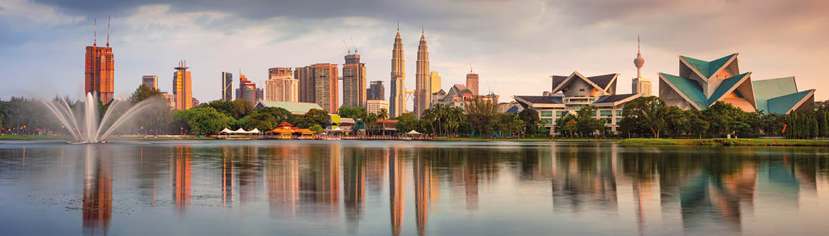 Panoramic cityscape image of Kuala Lumpur skyline during sunset 