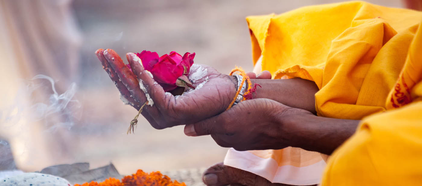 Varanasi, India - December 16, 2015 : Sacred flowers are taken for worship on hand at river Ganges, varanasi, uttar pradesh, india.