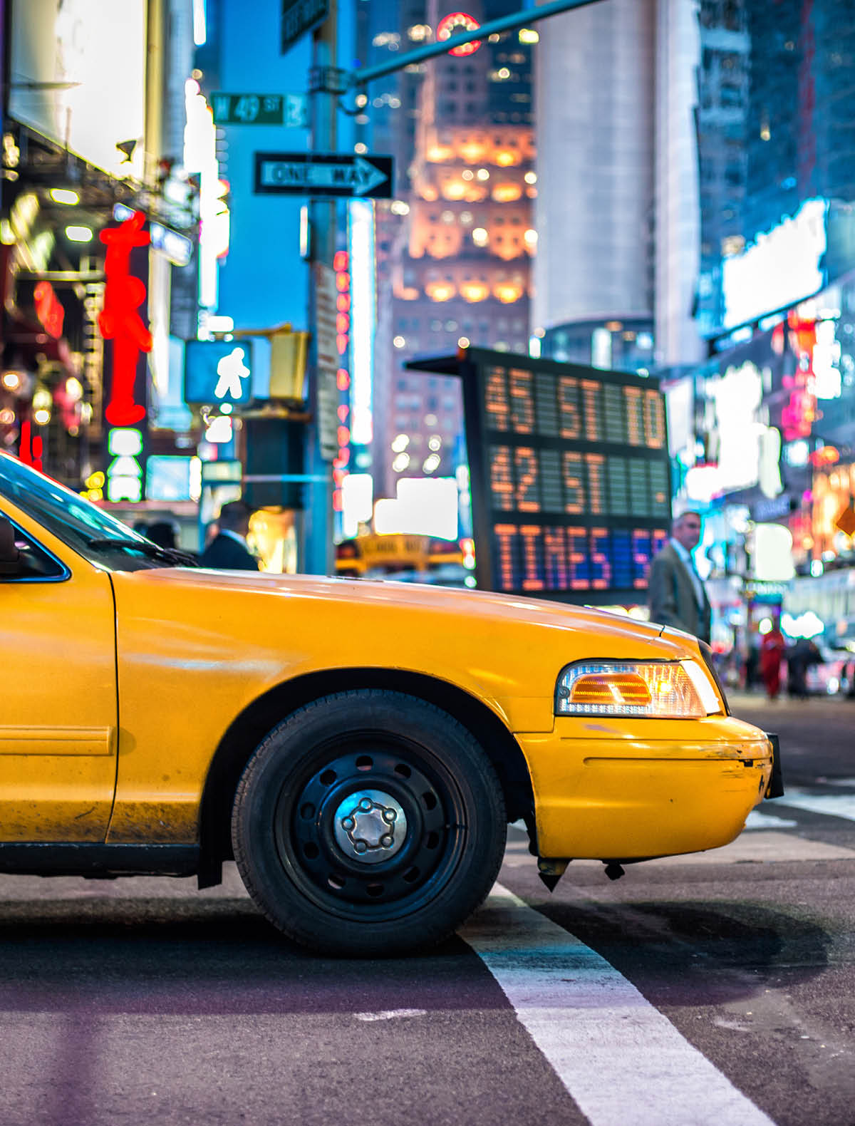 Yellow cabs in Manhattan, NYC. The taxicabs of New York City at night Time Square.