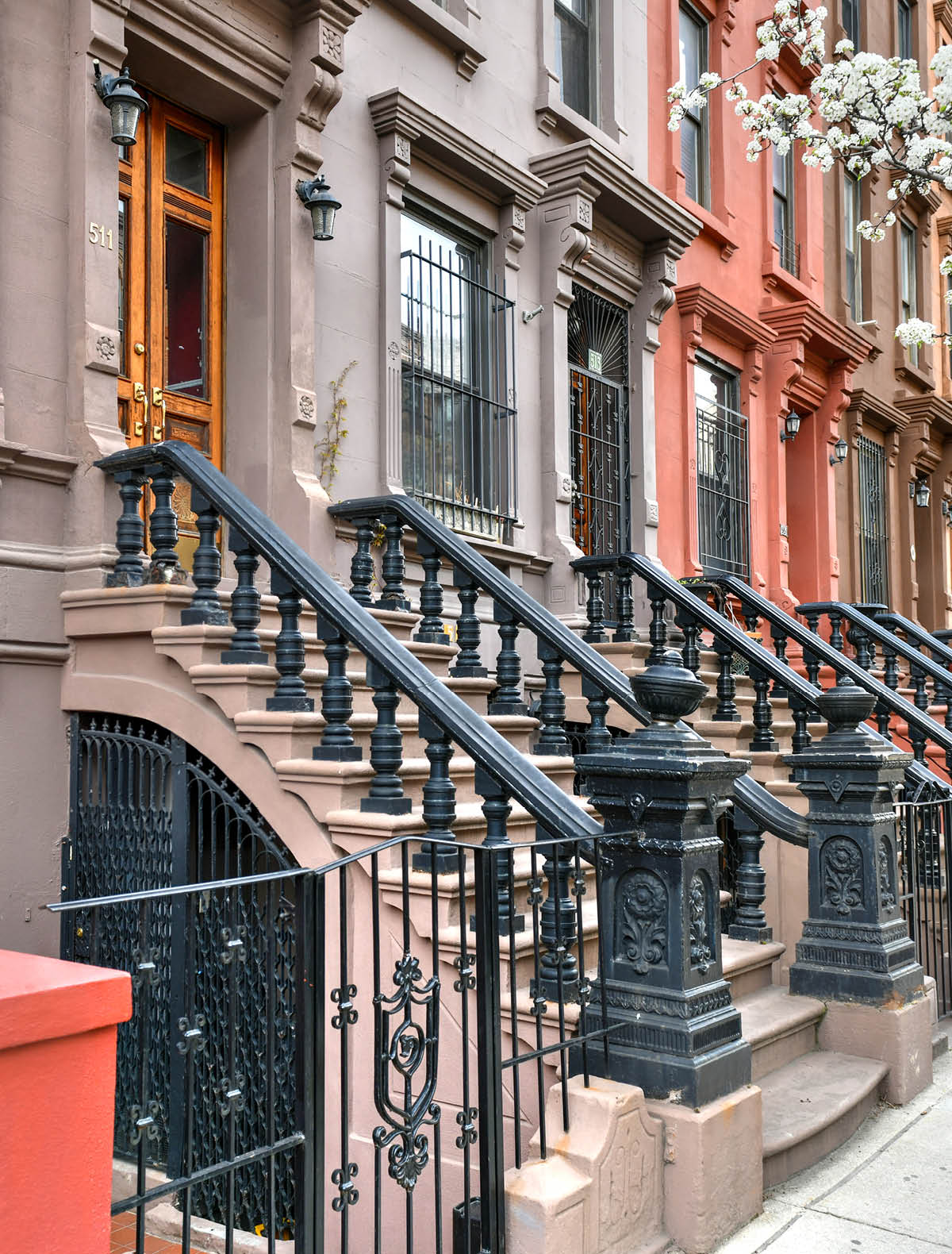 View of Brownstone buildings in Harlem in Manhattan, New York City.