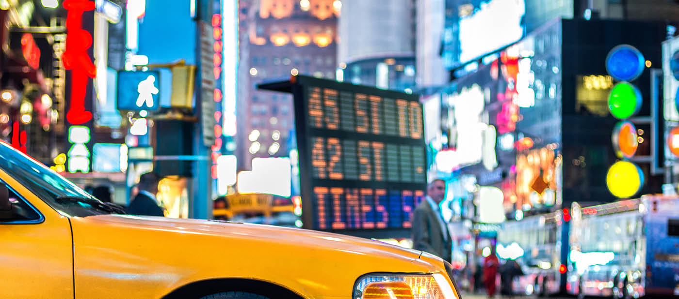 Yellow cabs in Manhattan, NYC. The taxicabs of New York City at night Time Square.