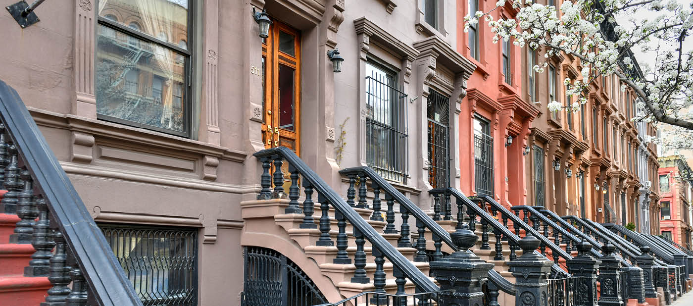 View of Brownstone buildings in Harlem in Manhattan, New York City.