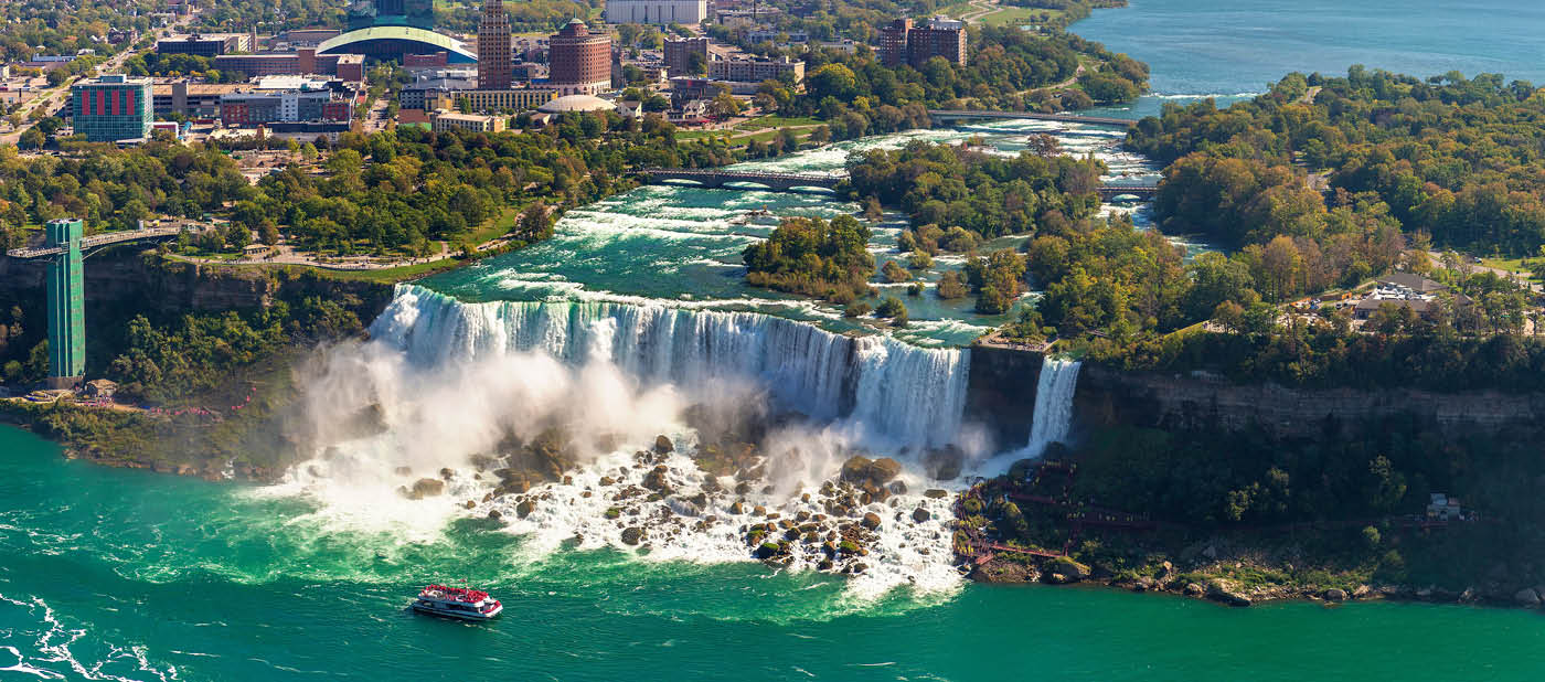 Panorama of aerial view of Canadian side view of Niagara Falls, American Falls and Observation Tower in Niagara Falls, Ontario, Canada