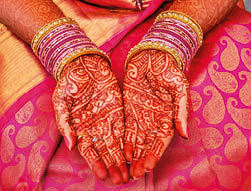 Decorated south indian bridal hands with henna