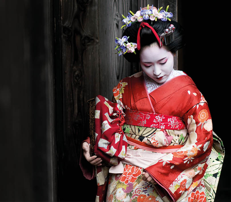 Portrait of a Geisha wearing a beautiful kimono and traditional  clothing - Japanese culture