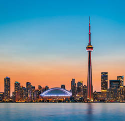 Skyline of Toronto over Ontario Lake at twilight