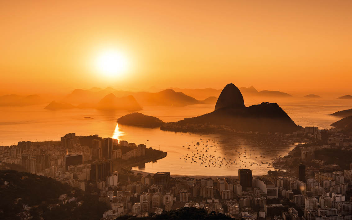 Golden Sunrise over Guanabara Bay in Rio de Janeiro with Sugarloaf Mountain in the Horizon 